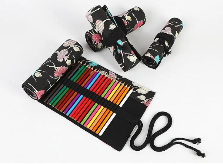 Canvas rolling pencil case with ballet girl print, showing multiple holes for pencils in a rolled-open state.