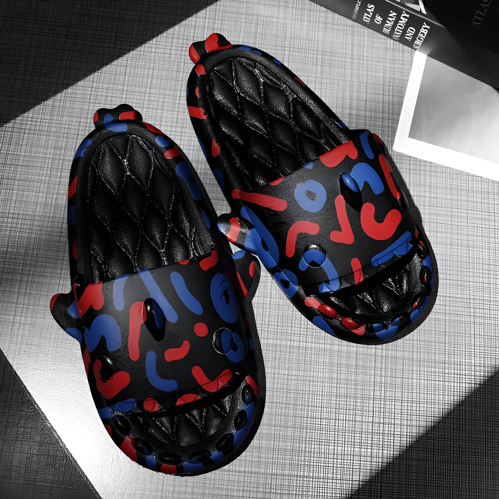 Beige EVA open-toe home slipper with a cute cartoon shark couple design on the footbed.