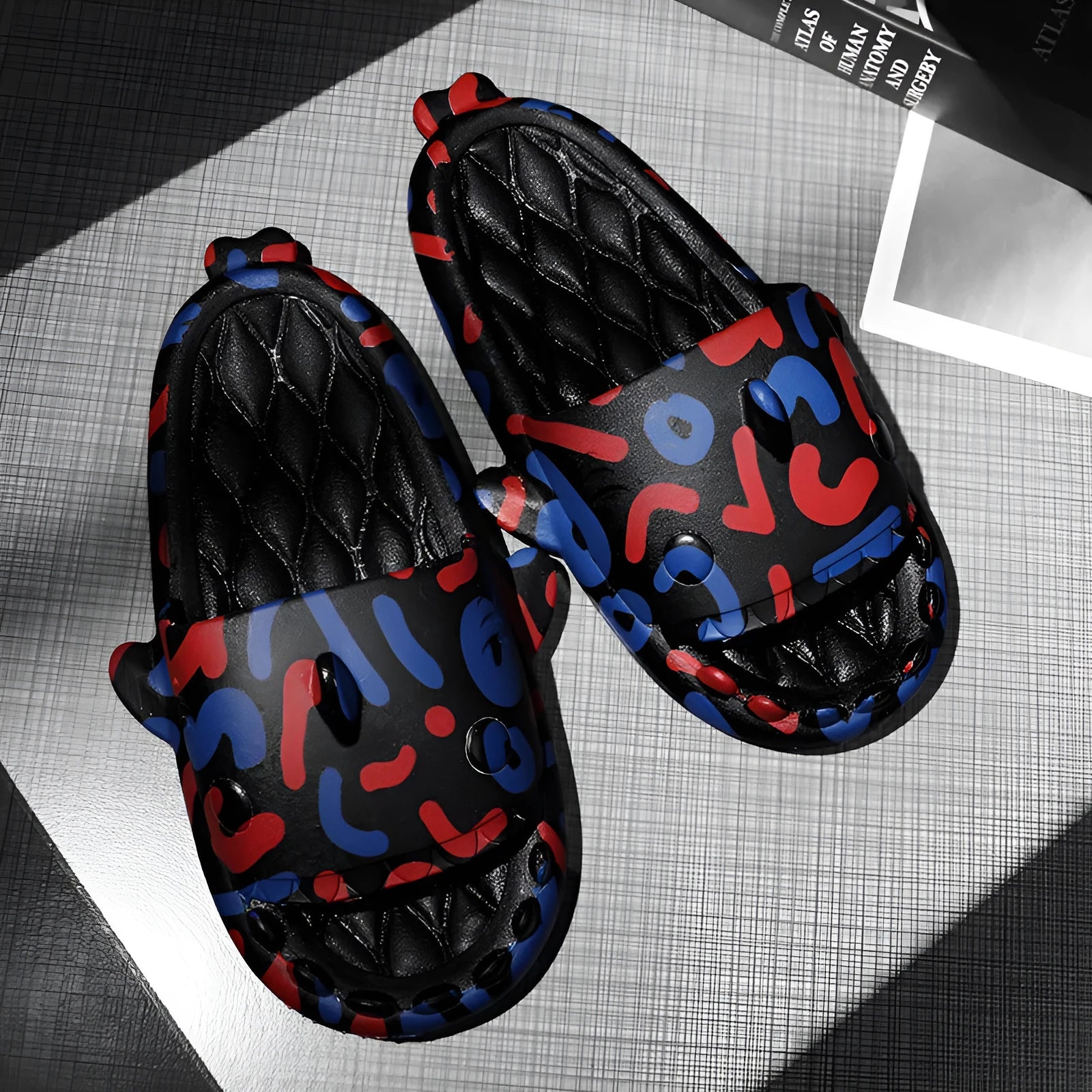 Beige EVA open-toe home slipper with a cute cartoon shark couple design on the footbed.