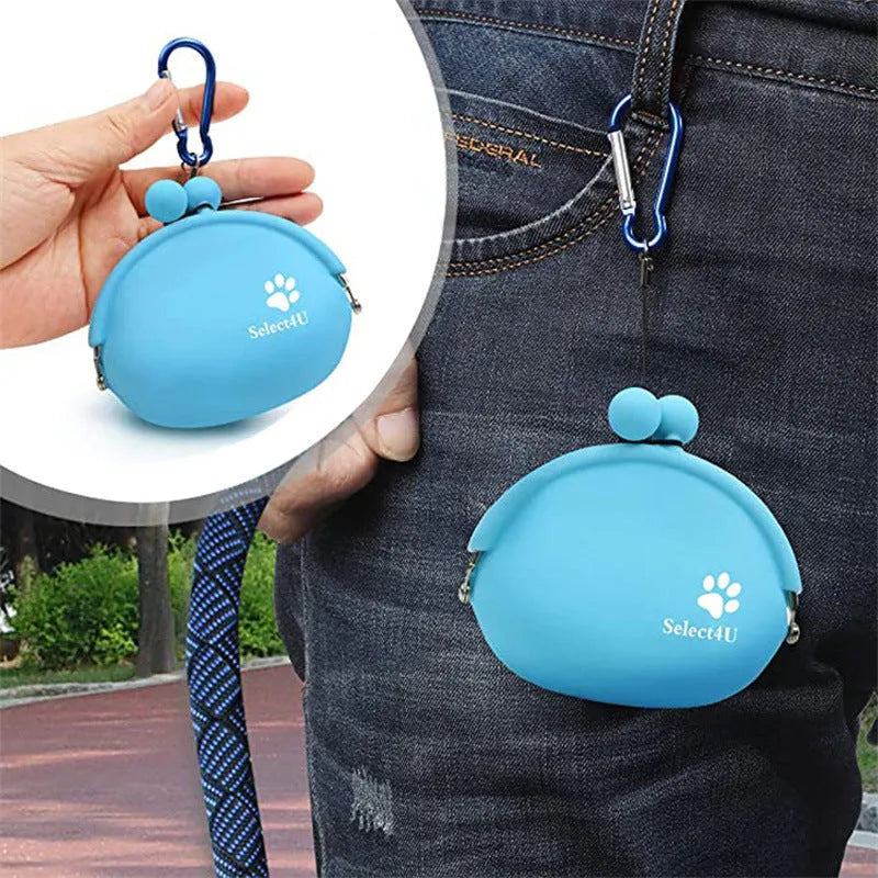 Yellow silicone dog treat pouch with hook-and-loop waist strap on a green background.