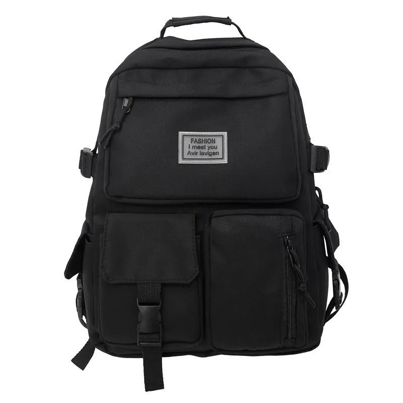 Black and white nylon student backpack with laptop compartment, showing three-dimensional pocket.
