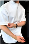 Men's white cotton t-shirt with button collar and buttoned chest pocket on a hanger