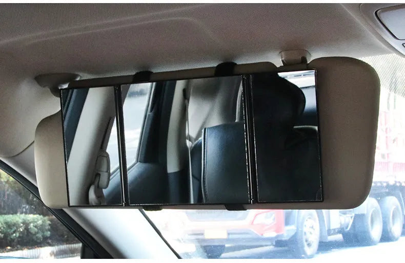 Silver car folding makeup mirror shown both closed at 15.5cm and open at 30.5cm wide.