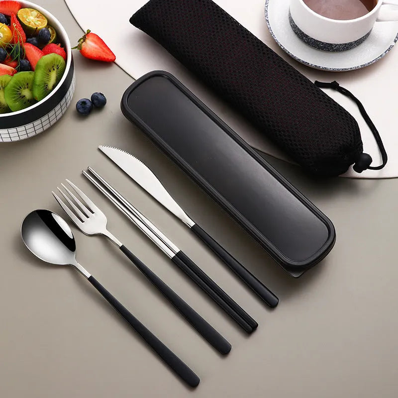 Four-piece stainless steel cutlery set with knife, fork, spoon and teaspoon in a mesh bag, gold and silver colour options