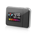 Black digital projection alarm clock with temperature and humidity display on bedside table