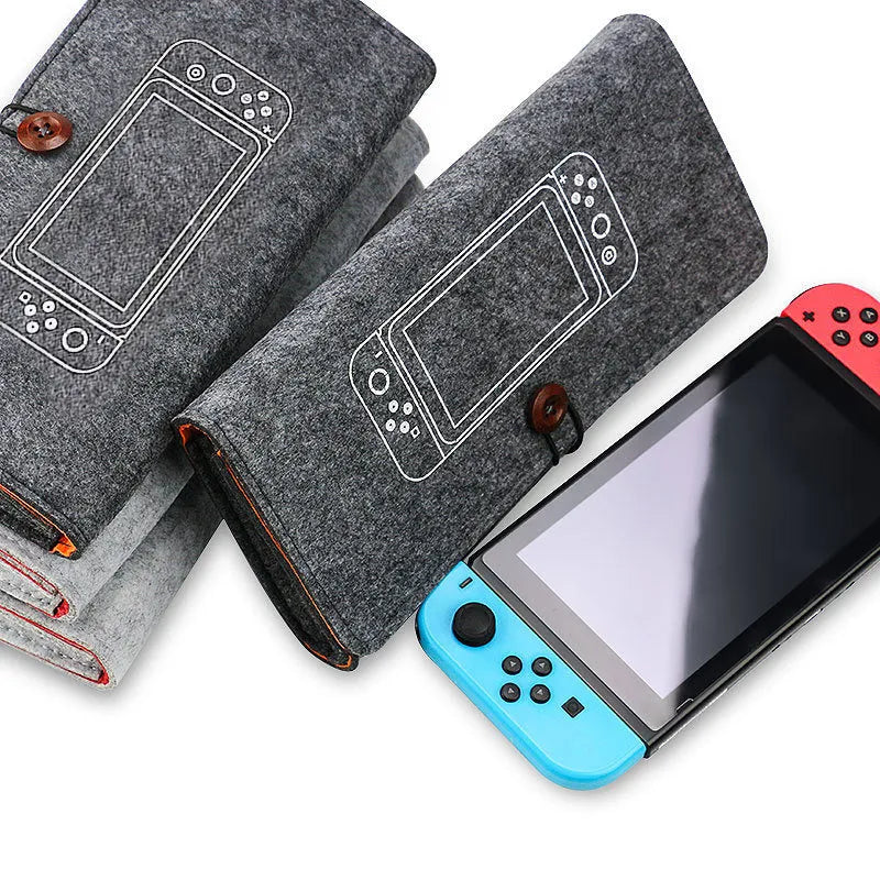Black felt pouch for Nintendo Switch console with a carrying handle and game card slots