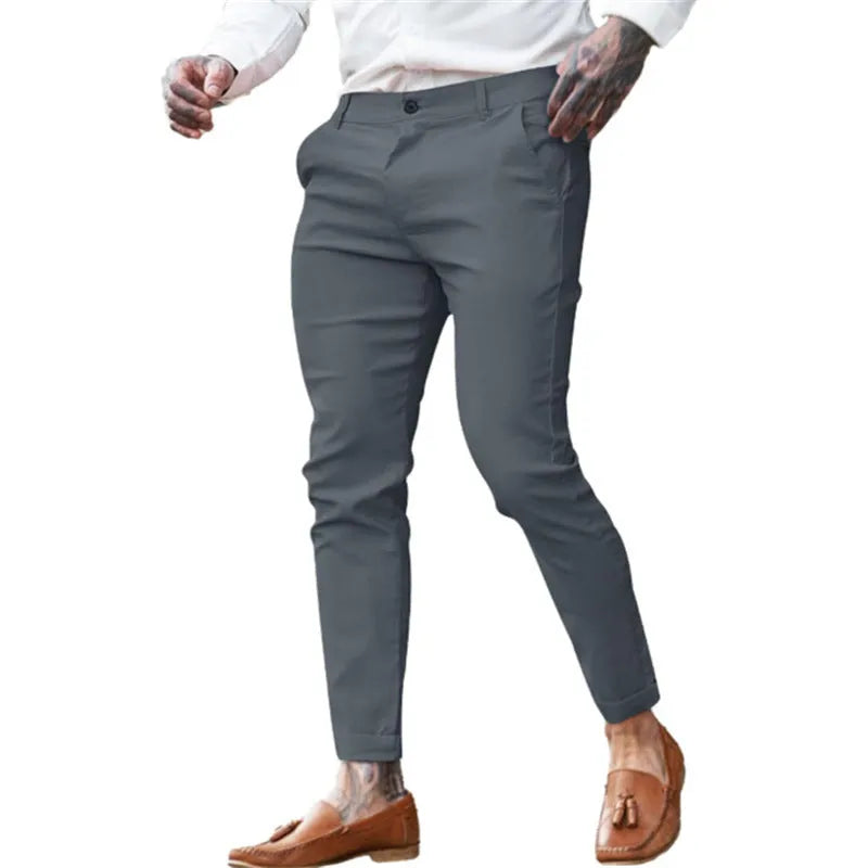 Men's slim fit pencil trousers in cotton twill fabric with stretch, showing mid waist and tapered leg.