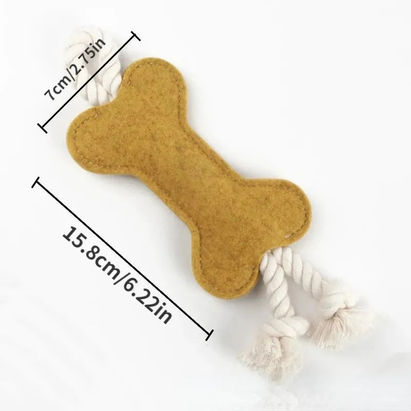 Bone-shaped felt dog chew toy with rope knot interior in blue, shown next to a tape measure indicating 16 cm length.