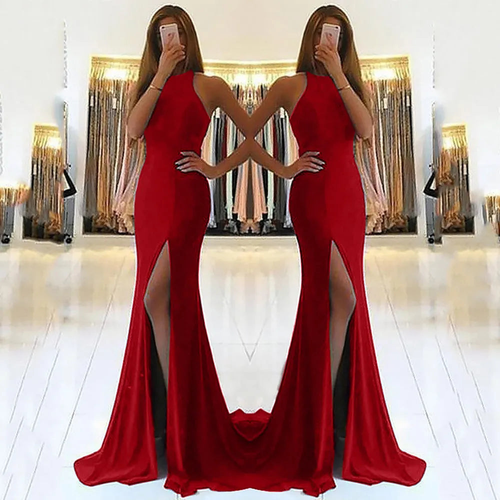 Red knitted evening dress with high waist, long swing skirt, and hollow design detail on mannequin