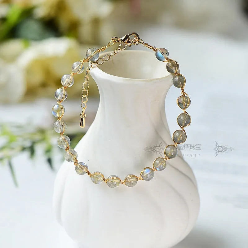 Women's moonstone crystal bracelet with 14K gold gilded metal and starry sky colour design