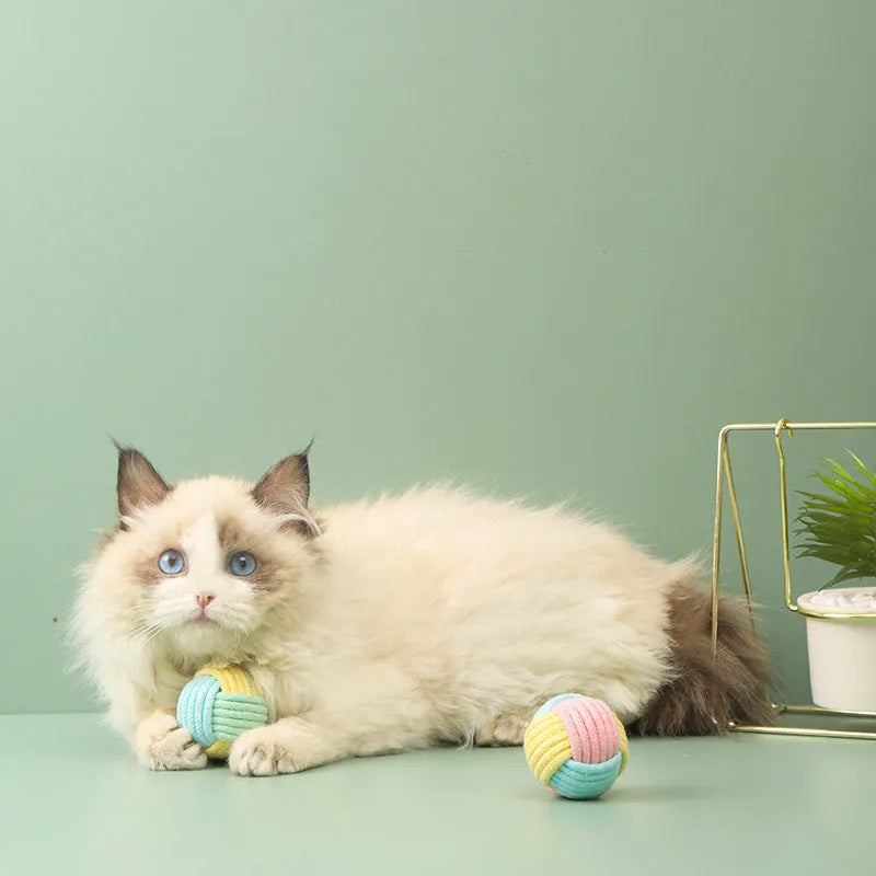 Handmade plush cotton cat hair ball toy in blue powder, green blue, or pink green colours for teeth grinding and boredom relief