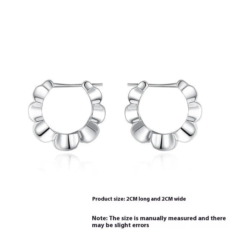 A pair of sterling silver retro geometric V-shaped earrings with a round element and electroplated finish.