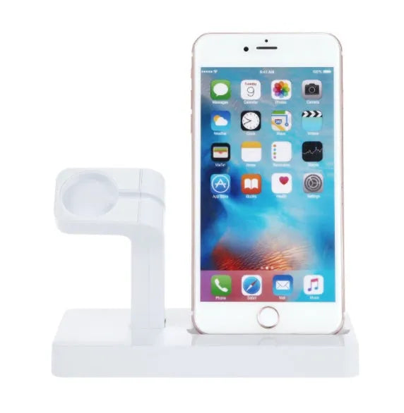 White 2-in-1 charging dock station holding an iPhone and an Apple Watch on a wooden desk.