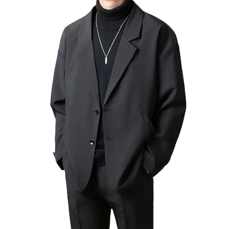 Man wearing a loose-fit apricot coloured casual suit jacket for smart-casual occasion.