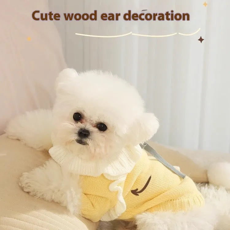 Yellow acrylic puppy sweater for small dog on size guide showing XS S M L XL chest measurements.