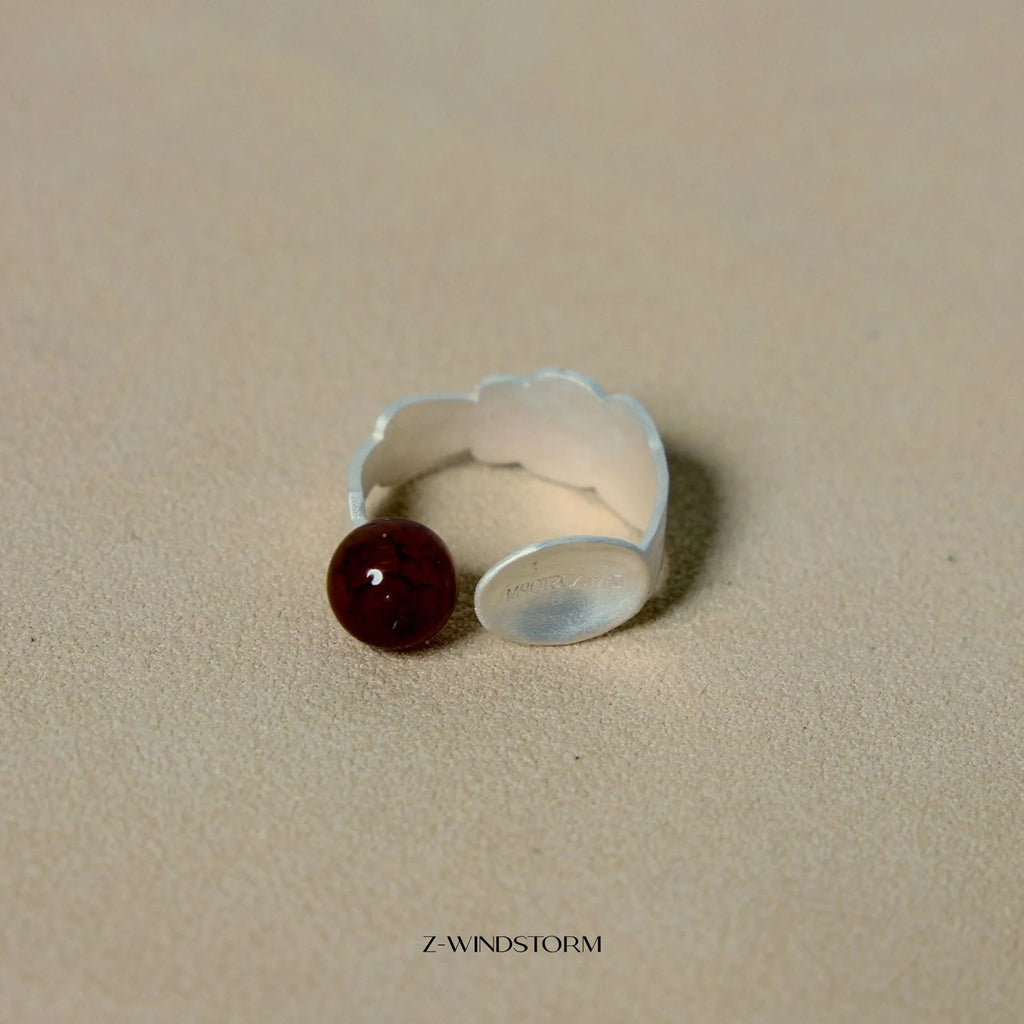 Silver tone alloy ring and bracelet set with a small stewed pork motif on diamond-shaped charms.