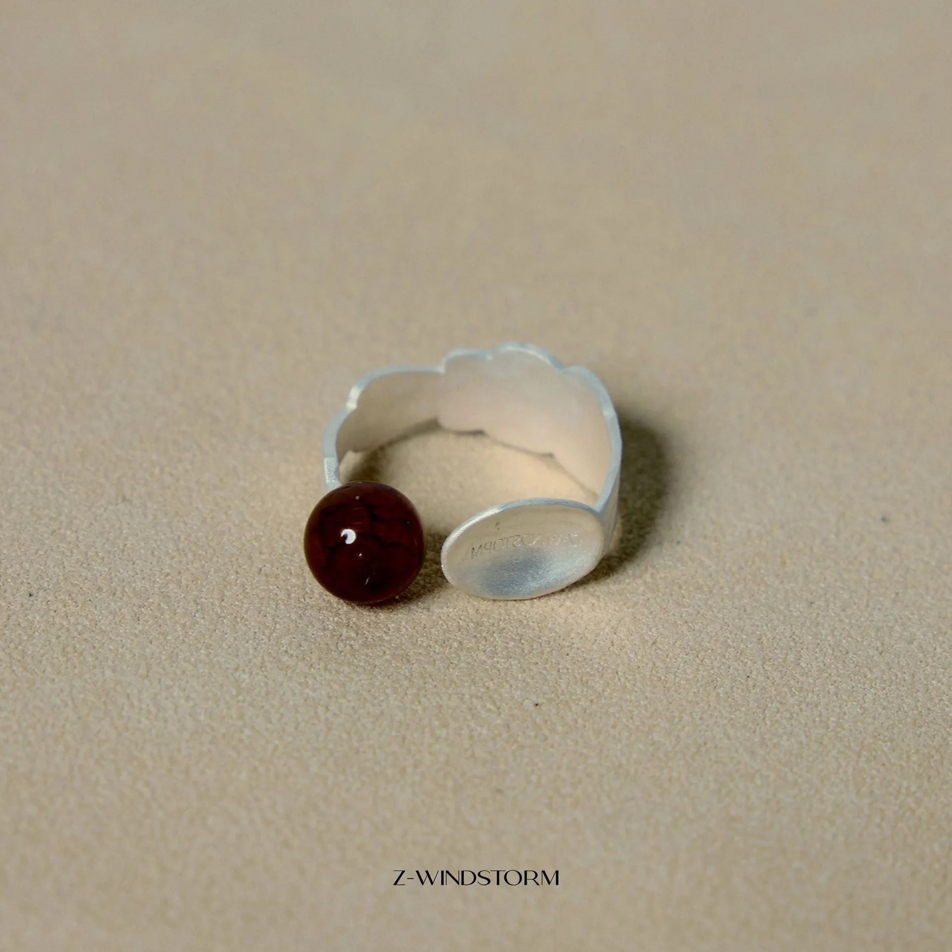 Silver tone alloy ring and bracelet set with a small stewed pork motif on diamond-shaped charms.