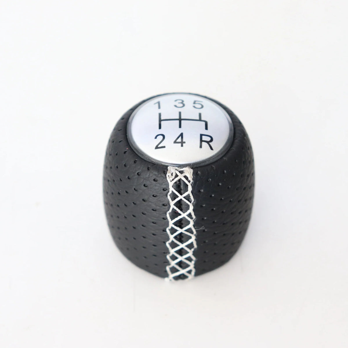 Black perforated PU leather gear knob for Alpha car with sewn seam, shown next to red and white line options.