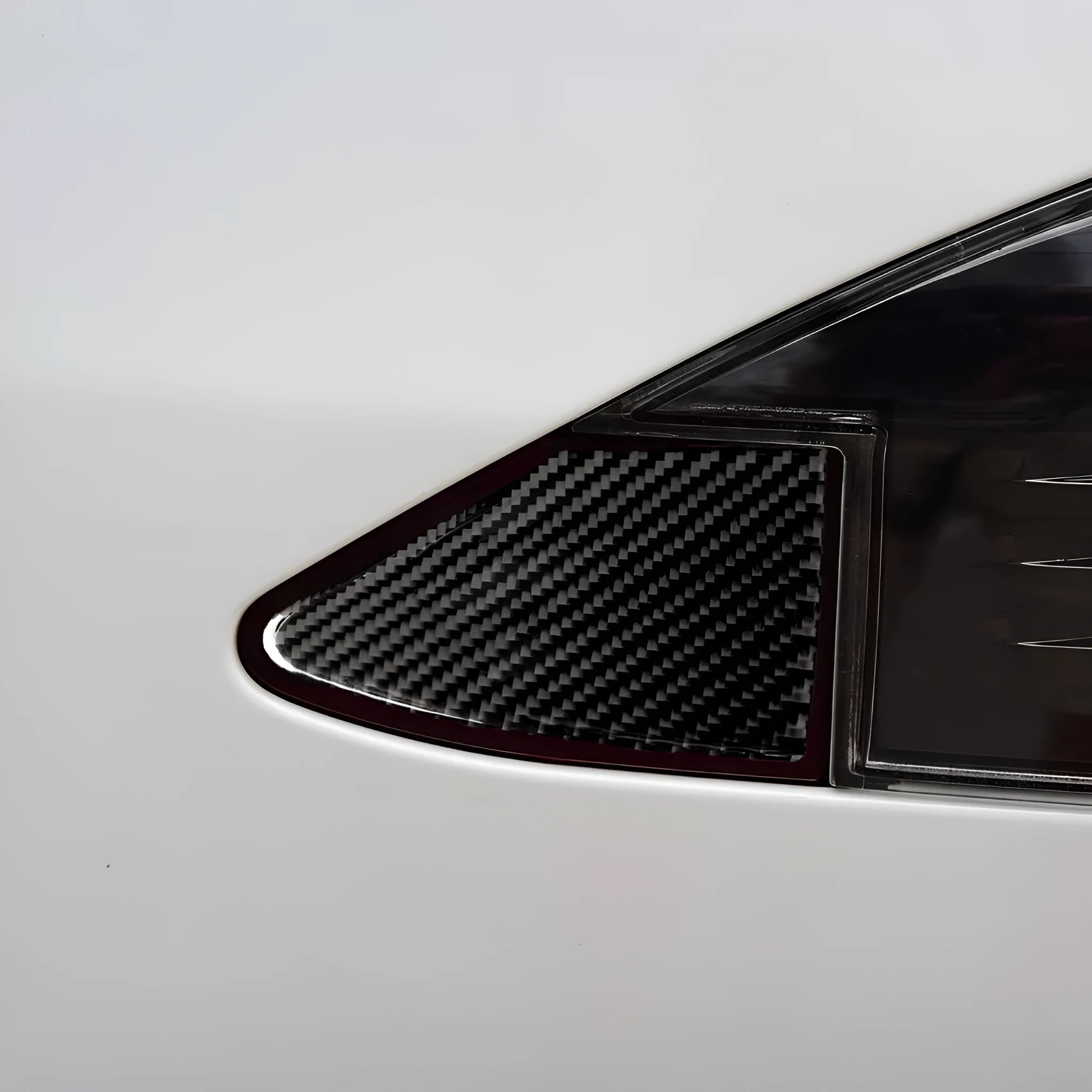 Carbon fibre textured sticker for car USB charging port panel with 3M adhesive backing.