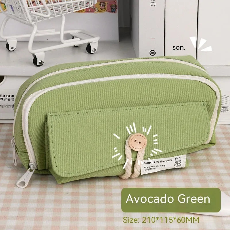 Korean style canvas pencil case in green, beige, blue, or grey, showing large capacity for pens.