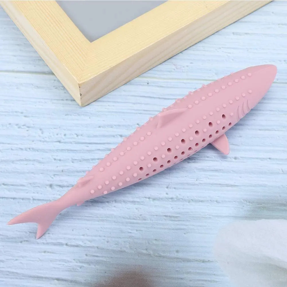 Green silicone fish-shaped cat chew toy with dental cleaning texture and side holes