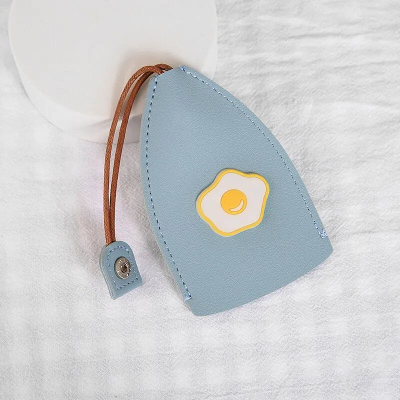 Colourful cartoon pull-out key case made from PU leather, showing the key extended from its protective sleeve.