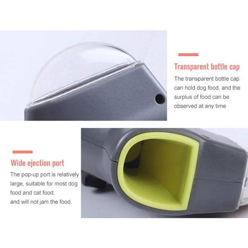 Grey pet snack catapult launcher toy on a table showing its size and spring trigger.