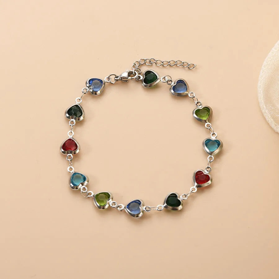 Devil's Eye geometric heart bracelet in stainless steel, shown in colourful, blue, green, or red electroplated finish