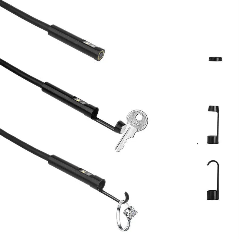 F300 wireless dual lens endoscope camera with 5.5mm and 8mm probes, hook, and magnet attachments on a table.