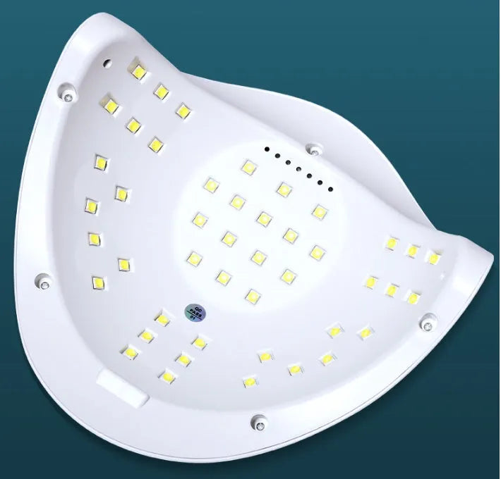 White nail polish baking lamp with UV LED lights and timer controls for gel manicure drying