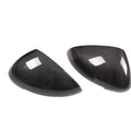 Genuine carbon fibre rearview mirror covers for a Porsche Macan, showing glossy black weave texture.