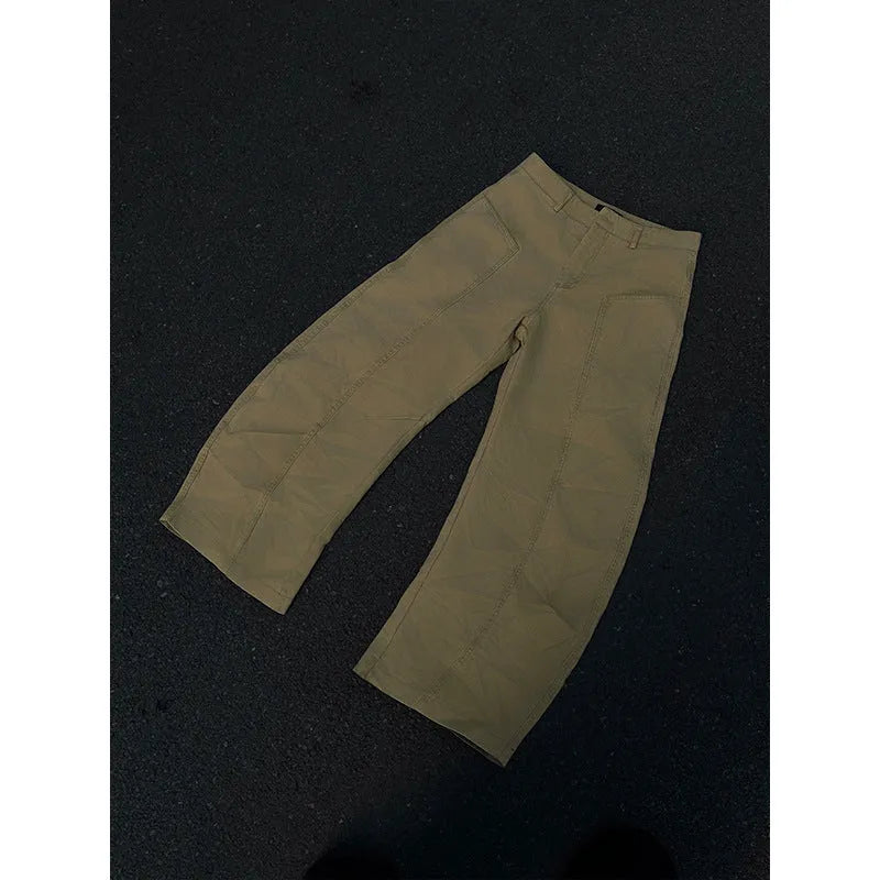 Men's khaki-coloured straight-leg cotton trousers laid flat, showing American retro casual style.
