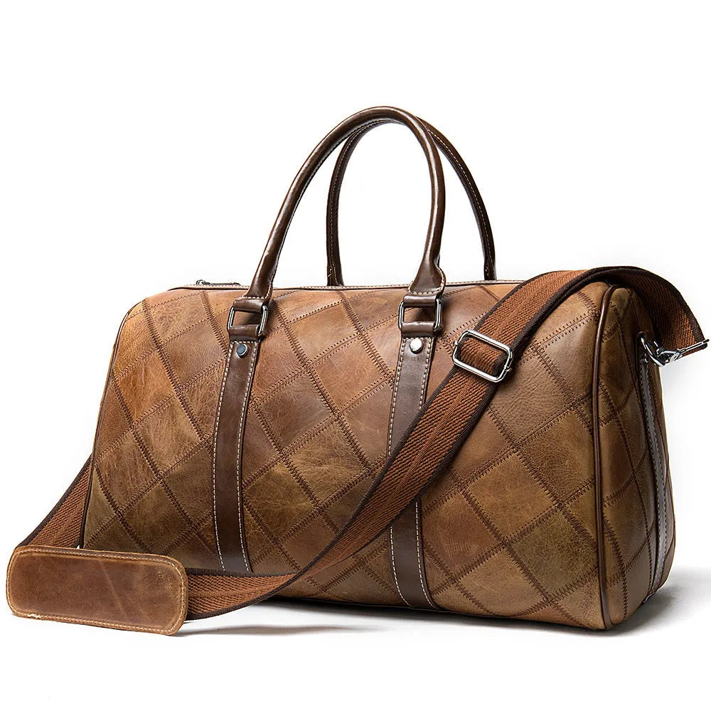 Vintage brown cowhide leather men's duffel bag with a single shoulder strap, shown open to reveal internal organiser pockets.