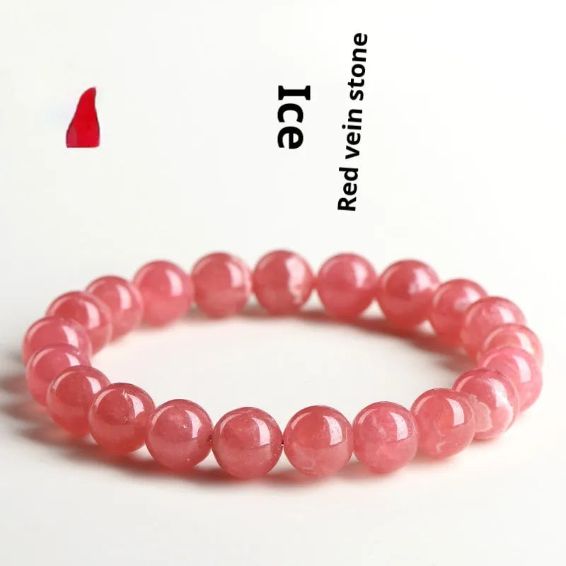 Women's red rhodochrosite crystal bracelet with geometric beads and Longevity Lock element.