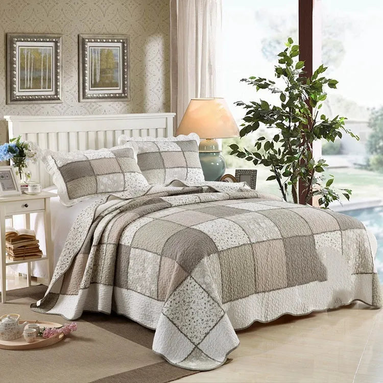 Pure cotton quilted bedspread and pillowcase three-piece set in a chosen colour pattern on a bed.