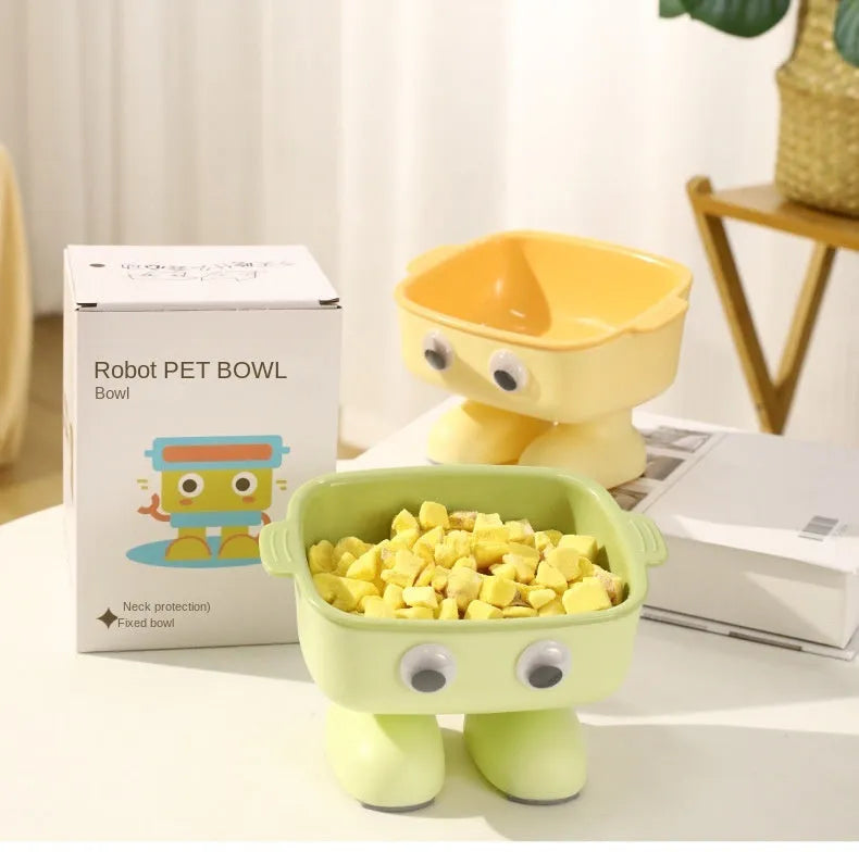 Robot-shaped elevated cat bowl with tilted feeding surface in green colour