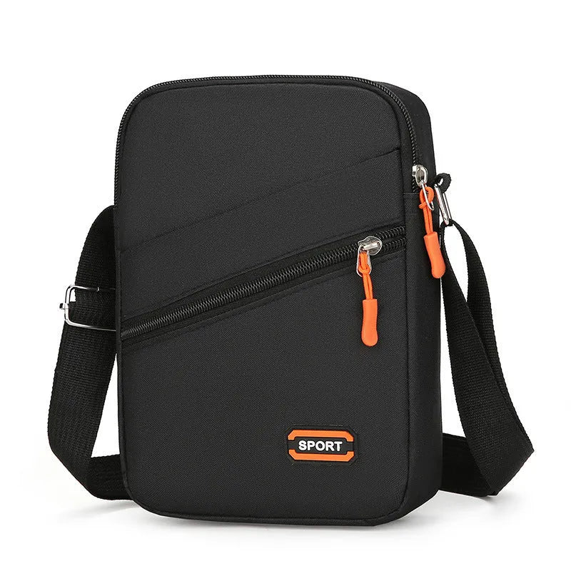 Lightweight solid colour oxford cloth crossbody commuter bag in black, navy, or silver grey.
