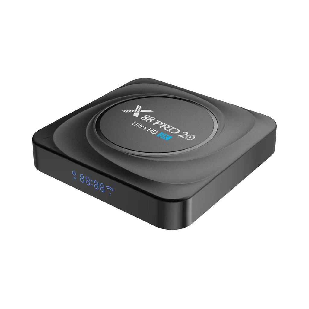 Compact black Android 11 TV box with HDMI port, remote control, and power supply on a wooden surface.