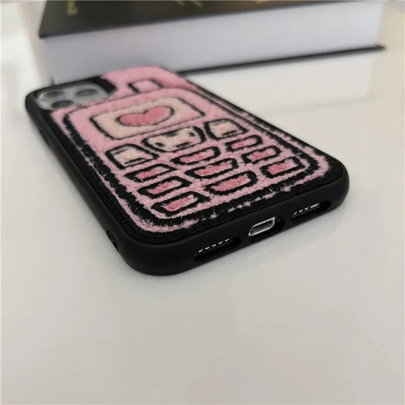 Pink TPU iPhone case with a raised towel embroidery texture on the back.