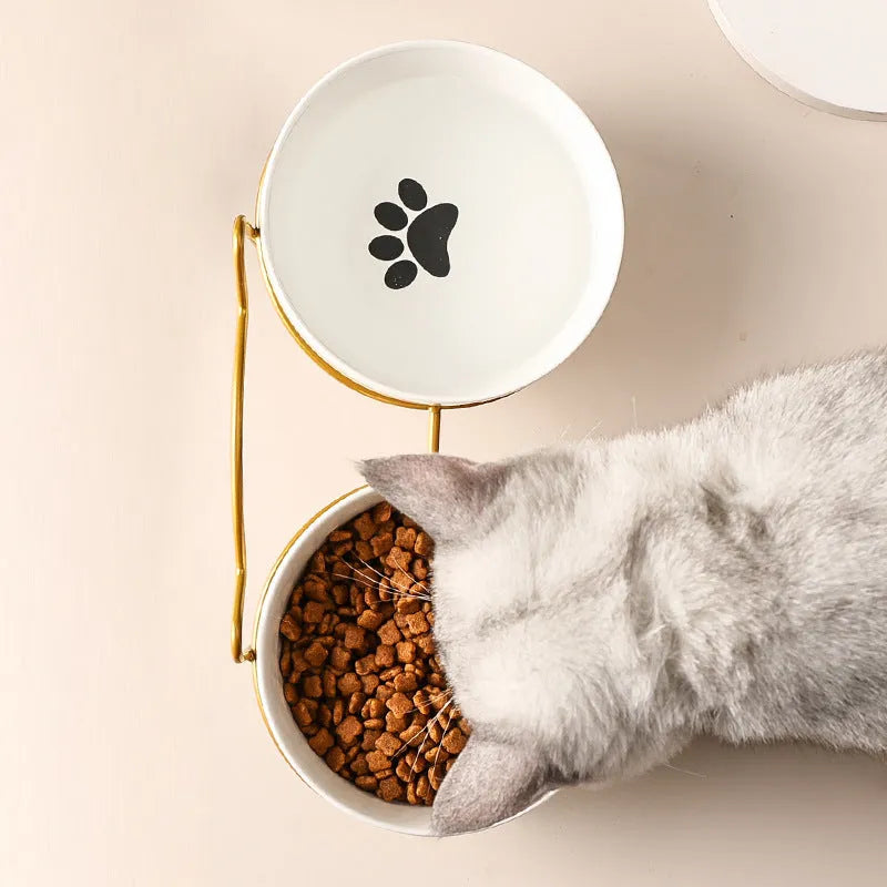Ceramic pet bowl with iron frame featuring cat footprints pattern