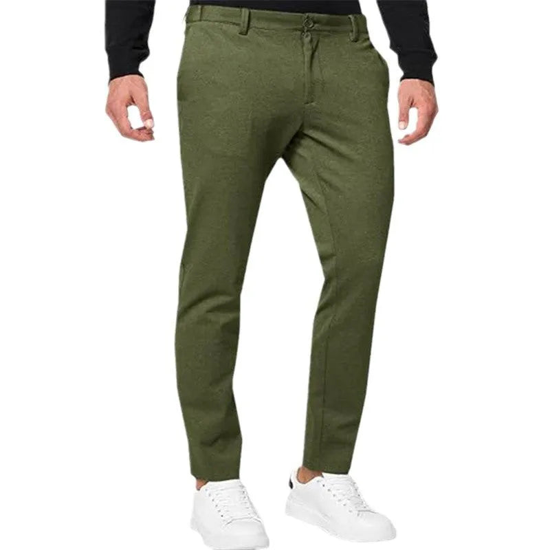 Men's slim-fit tapered chino trousers in a cotton blend stretch fabric on a hanger.