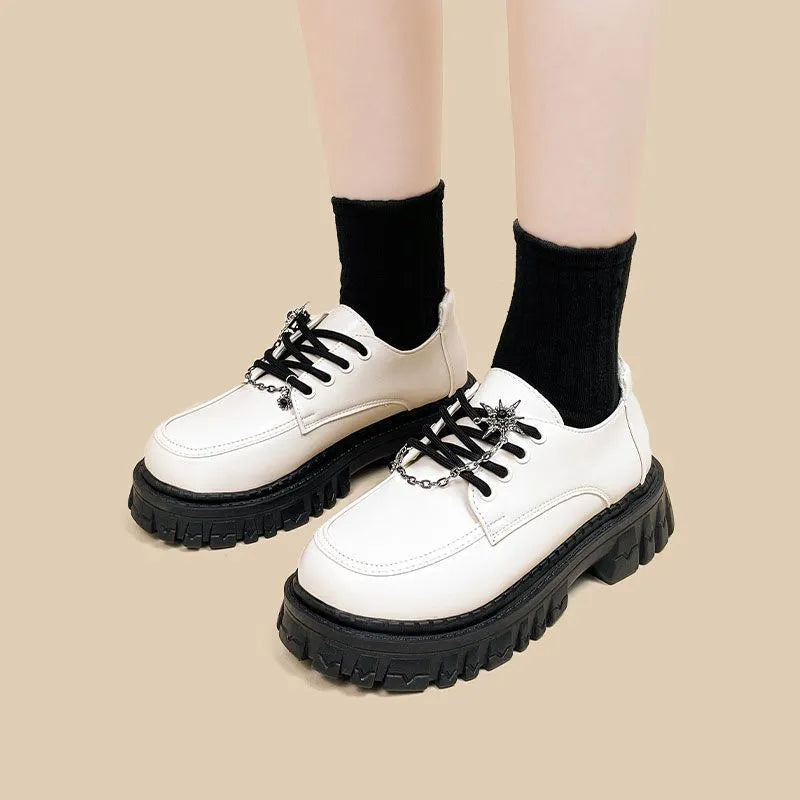 Women's Duke Asterism colour loafers with a metallic cross shoulder strap and round toe.