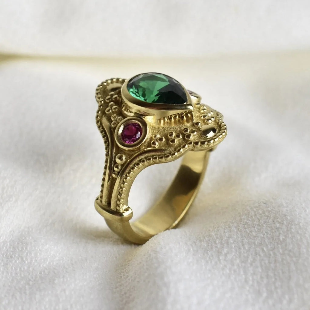Golden geometric women's fashion ring on display showing electroplated finish and geometric design details