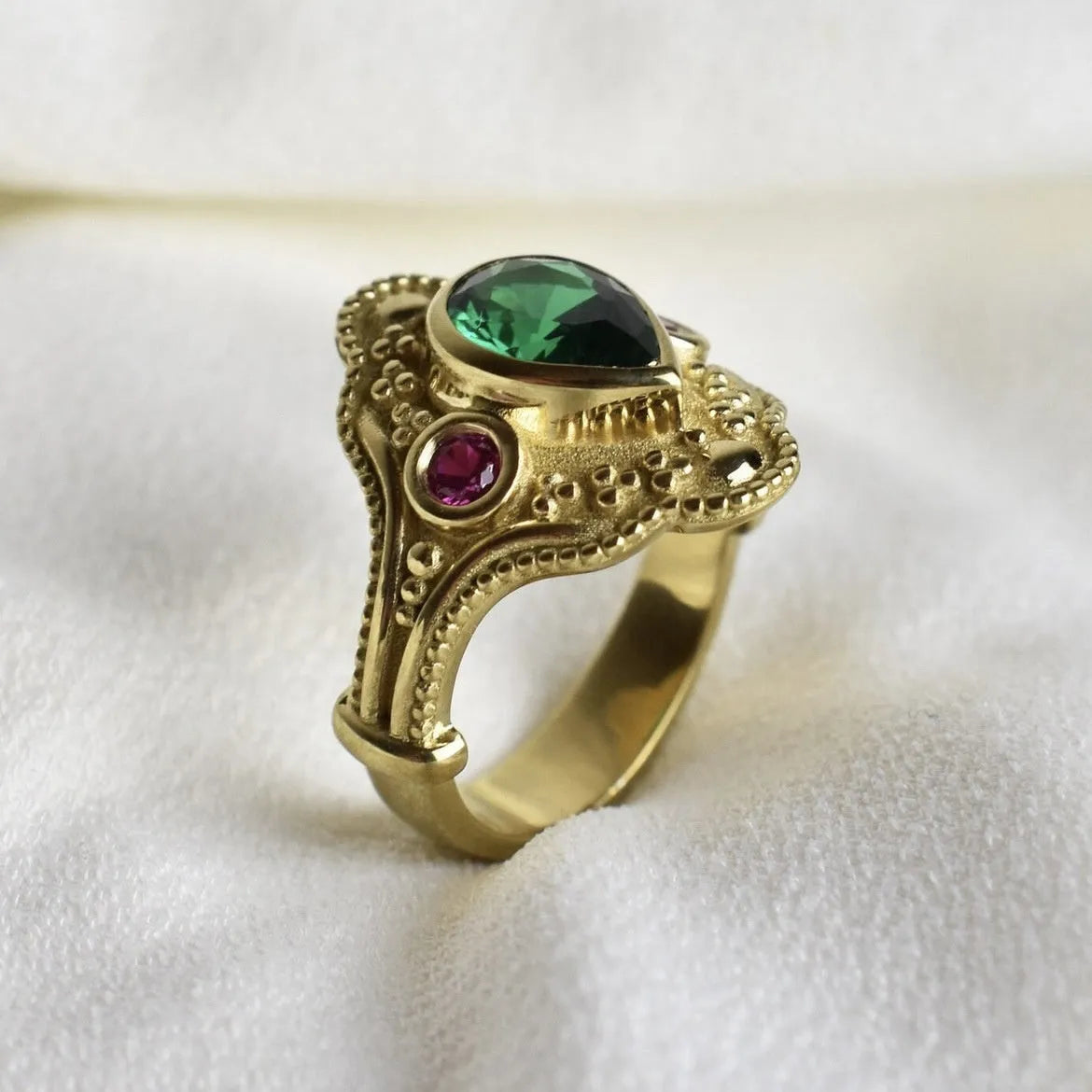 Golden geometric women's fashion ring on display showing electroplated finish and geometric design details