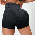 Women's brown gradient high waisted fitness shorts laid flat, showing nylon blend lining.