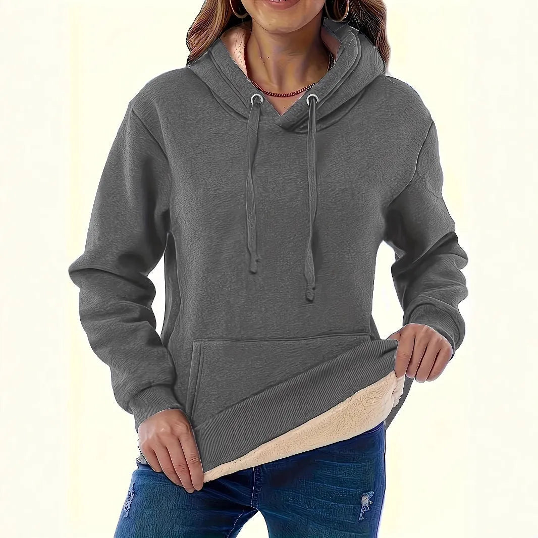 Women's loose fit grey hooded sweatshirt with a 3D textured pattern and a front pocket.