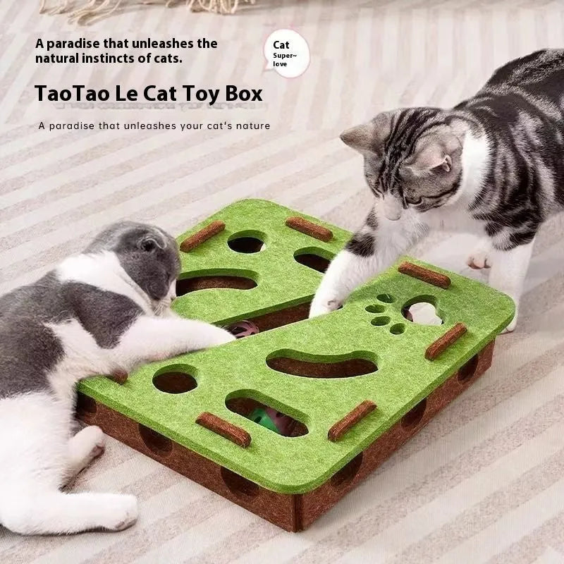 Green brown felt square cat toy with a hole in the centre on a wooden floor.