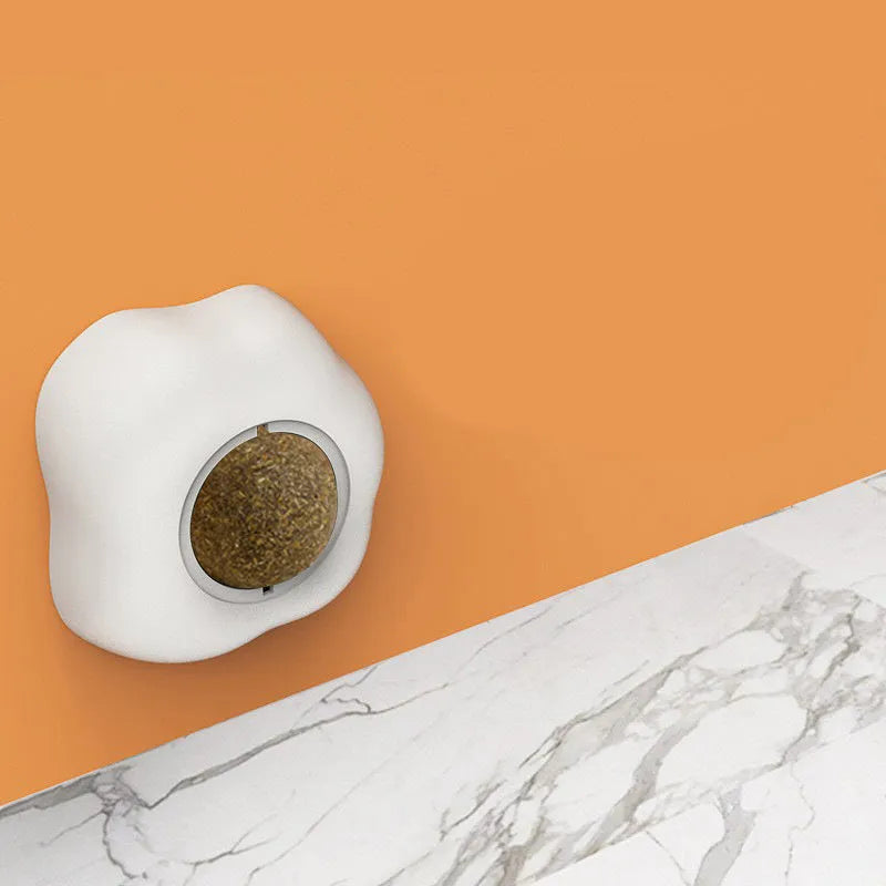 Interactive catnip ball toy with adhesive backing for walls, available in fried egg and poached egg designs