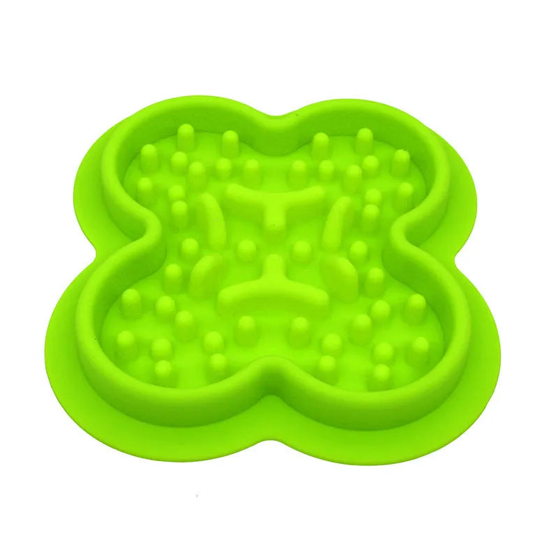 Silicone pet licking pad slow feeder mat in various colours on a floor