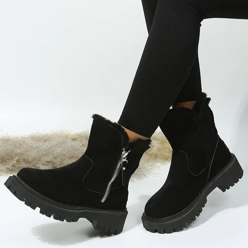 Women's black faux suede snow boots with thick plush lining and side zip closure